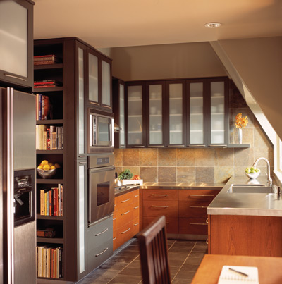 Shelving built into or hung on extra wall space provides storage for cookbooks, décor or tools without taking up valuable counter space.